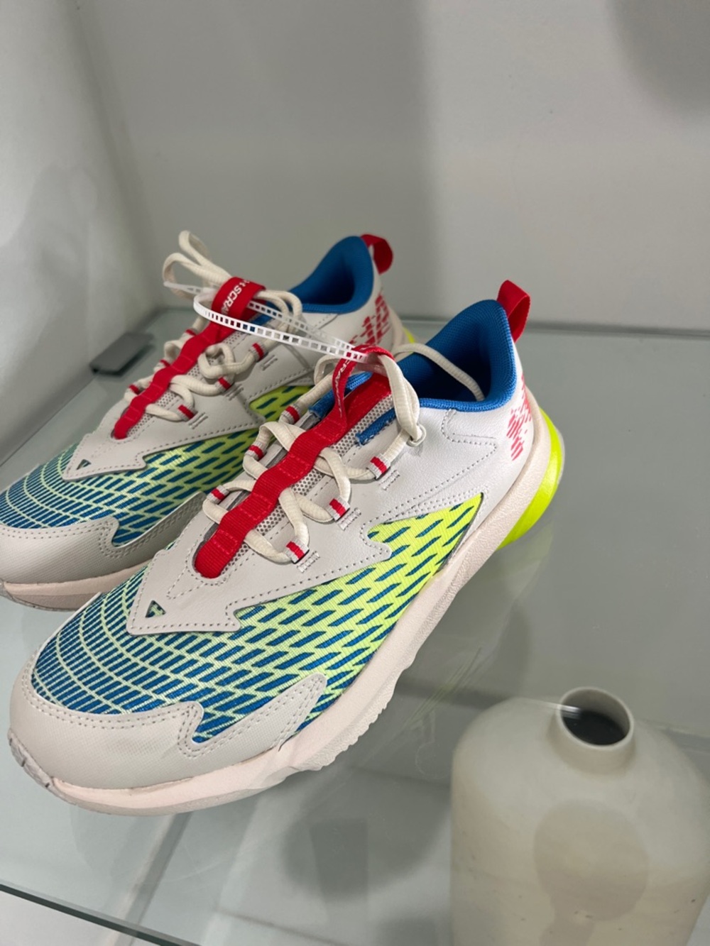 Under Armour White Sneakers with Blue, Neon Yellow and Red Accents